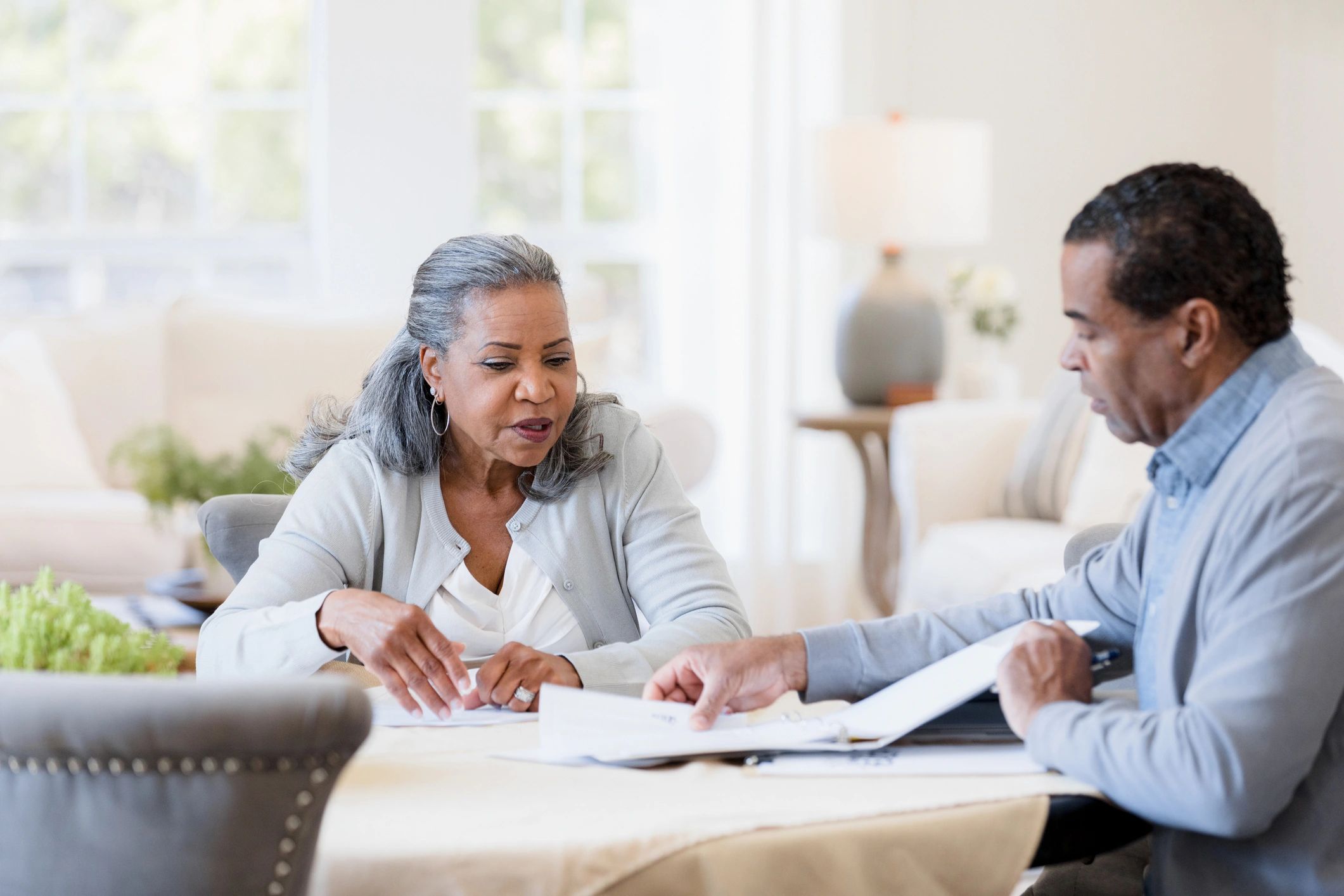 Homeowners reviewing mortgage documents together