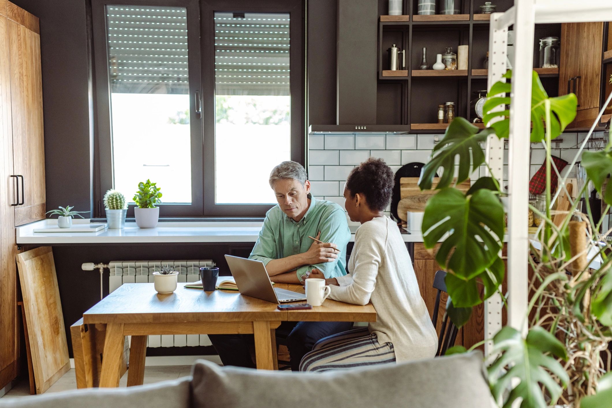 Homeowners reviewing mortgage documents together
