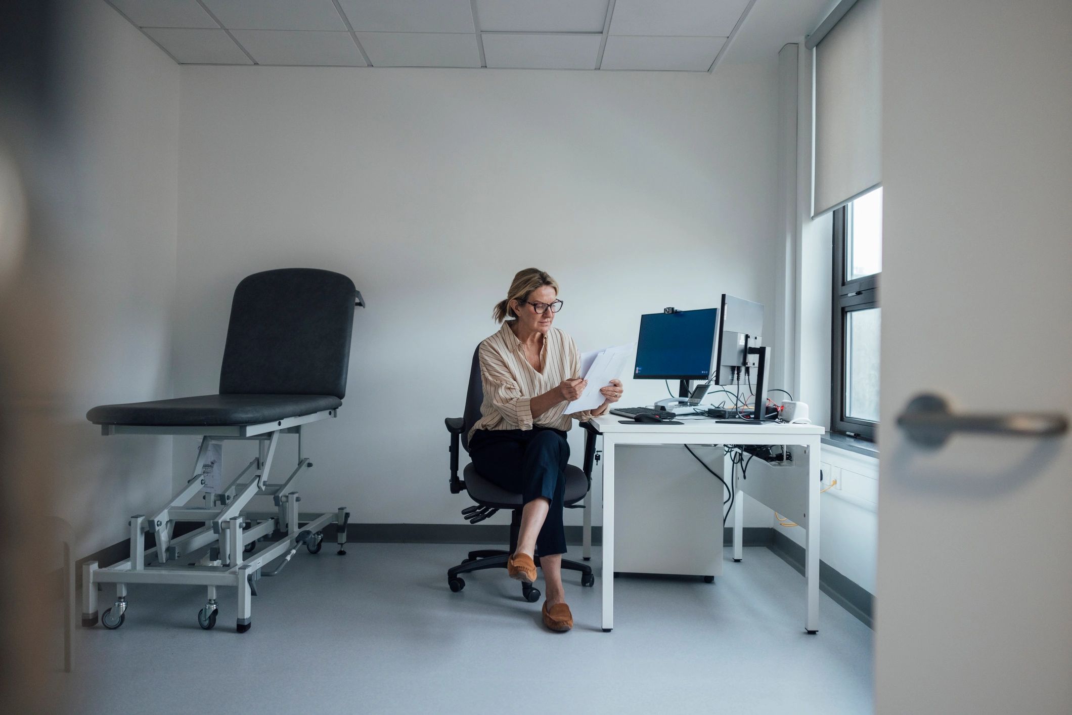 Homeowner reviewing documents at a desk