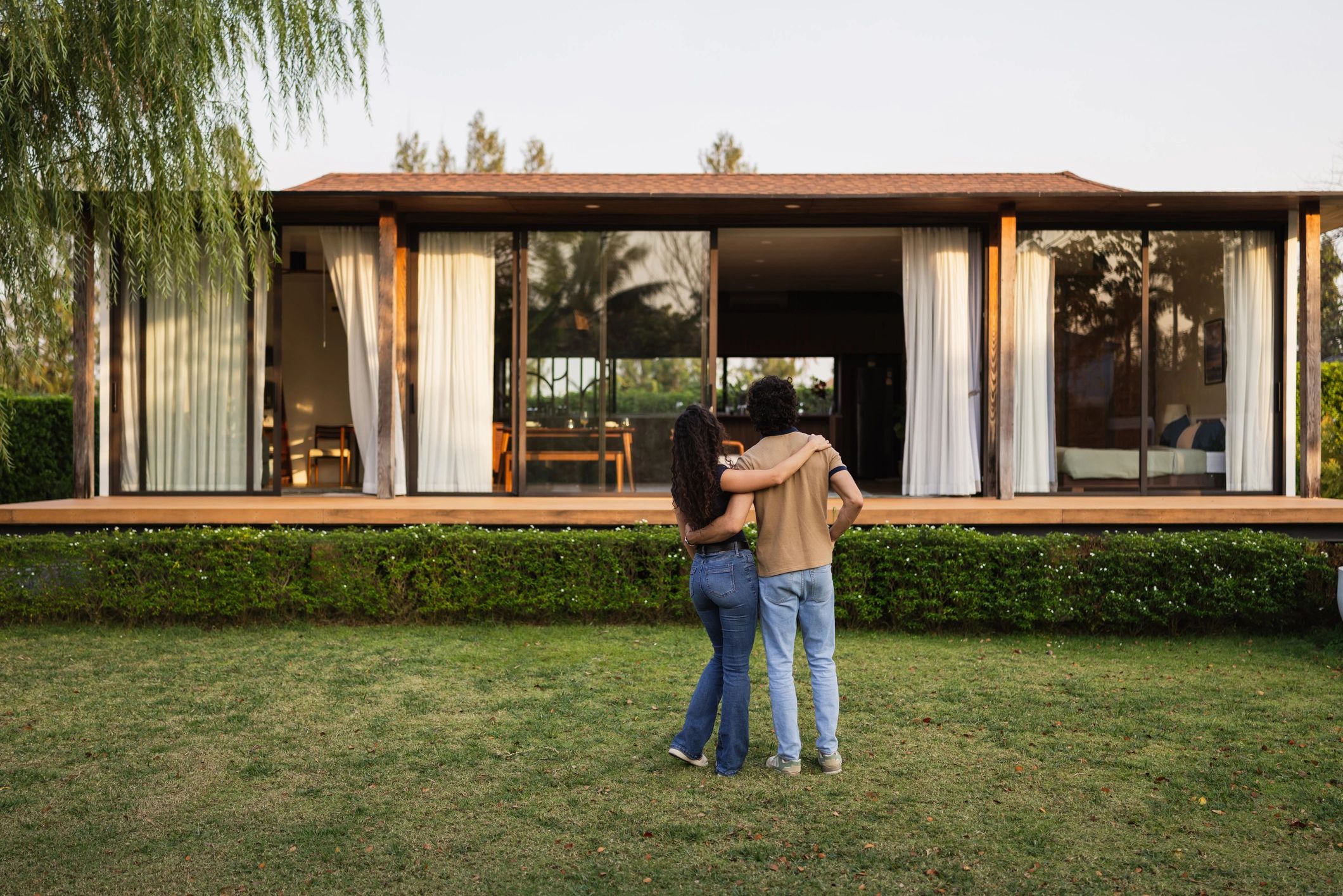 Homeowners looking at their modern home